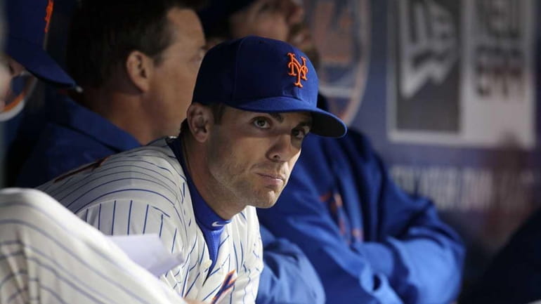 David Wright looks on from the dugout during a game...