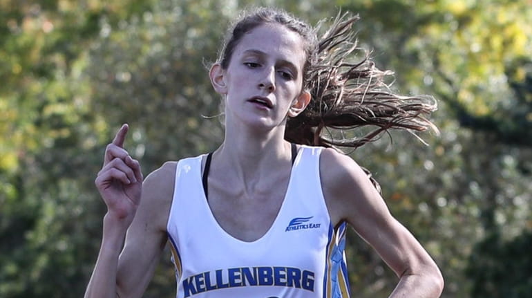 Kellenberg's Kathleen Healy crosses the finish line in a time...