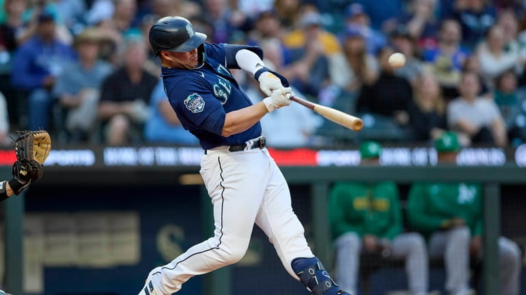 Seattle Mariners' Ty France hits a solo home run off...