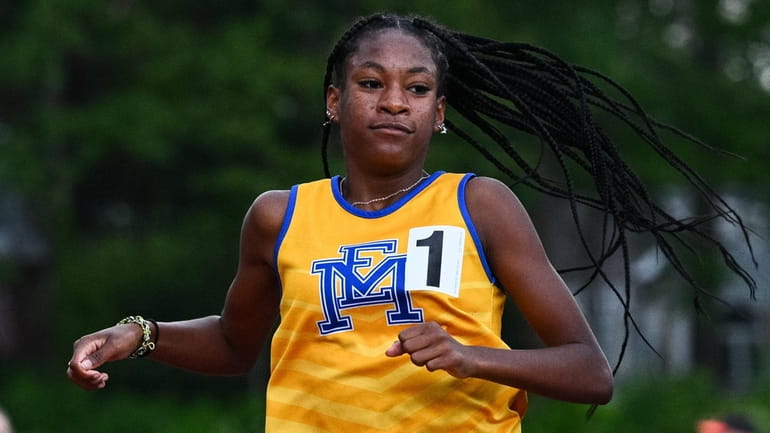 Zaria Hall of East Meadow wins the Division I 1,500-meter run...