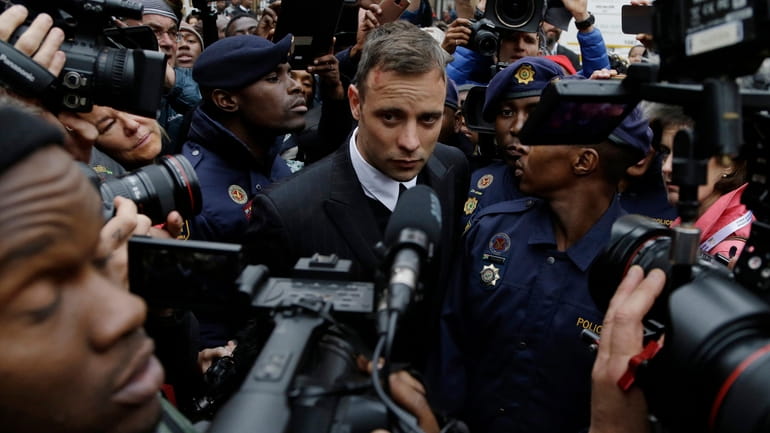 FILE - Oscar Pistorius leaves the High Court in Pretoria,...