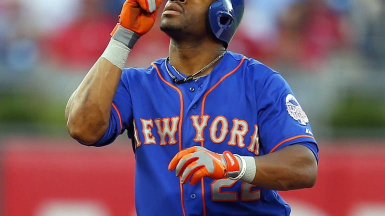 Eric Young of the Mets gestures after hitting a double...