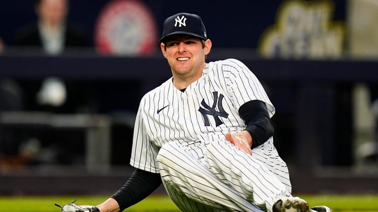 New York Yankees starting pitcher Jordan Montgomery reacts after being...