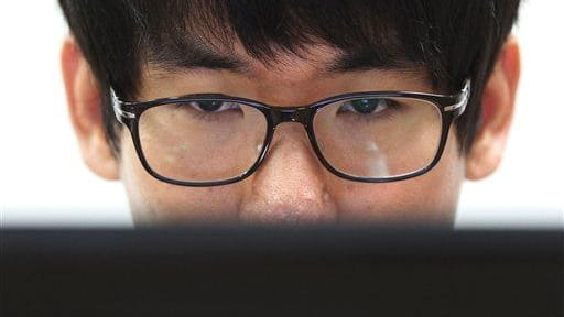 Simon Choi, a South Korean cybersecurity researcher, watches his personal...