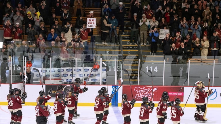 Montreal salutes the crowd following a PWHL hockey game against...