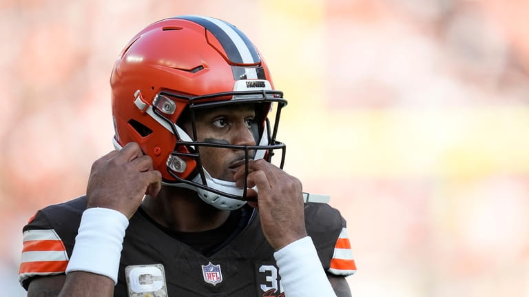 Cleveland Browns quarterback Deshaun Watson (4) adjusts his helmet during...