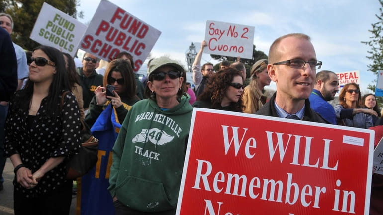 Local public school teacher unions, anti-frackers, and other activists protested...