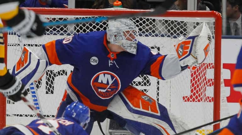 Islanders goaltender Robin Lehner (40) make the glove save during...