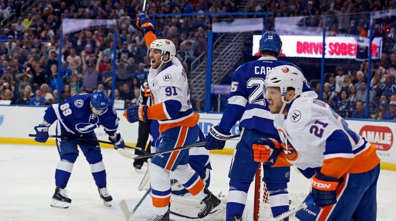John Tavares #91 and Kyle Okposo #21 of the New...