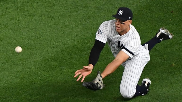 Yankees right fielder Aaron Judge makes the catch on the...