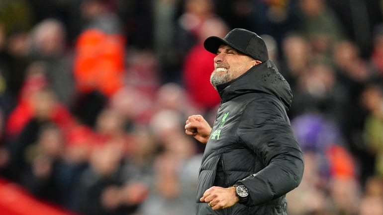 Liverpool's manager Jurgen Klopp celebrates at the end of the...
