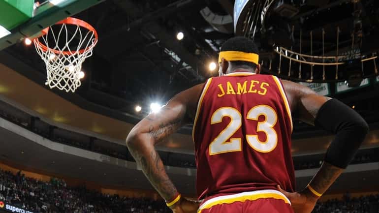 LeBron James #23 of the Cleveland Cavaliers waits for the...