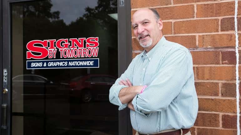 Ron Facchiano, president of Signs By Tomorrow Commack-Hauppauge, seen on...