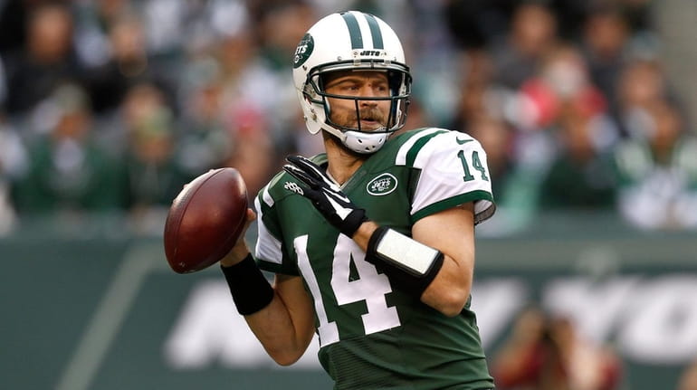 Ryan Fitzpatrick #14 of the New York Jets throws a...