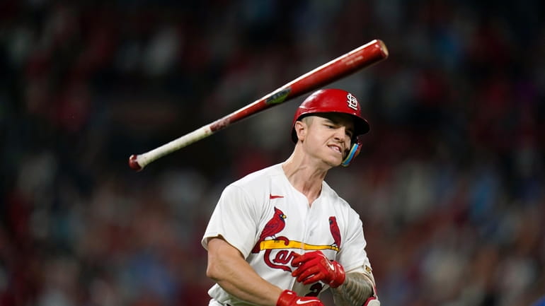 St. Louis Cardinals' Tyler O'Neill tosses his bat in celebration...