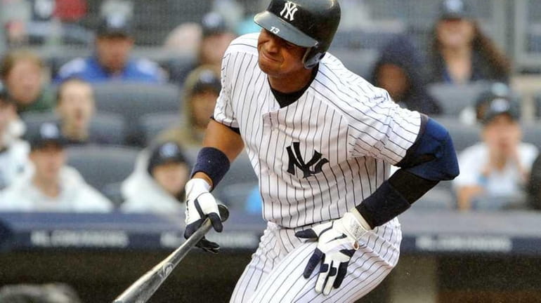 New York Yankees third baseman Alex Rodriguez (13) reacts being...