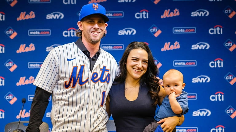 Jeff McNeil poses with his wife Tatiana and son Lucas during...