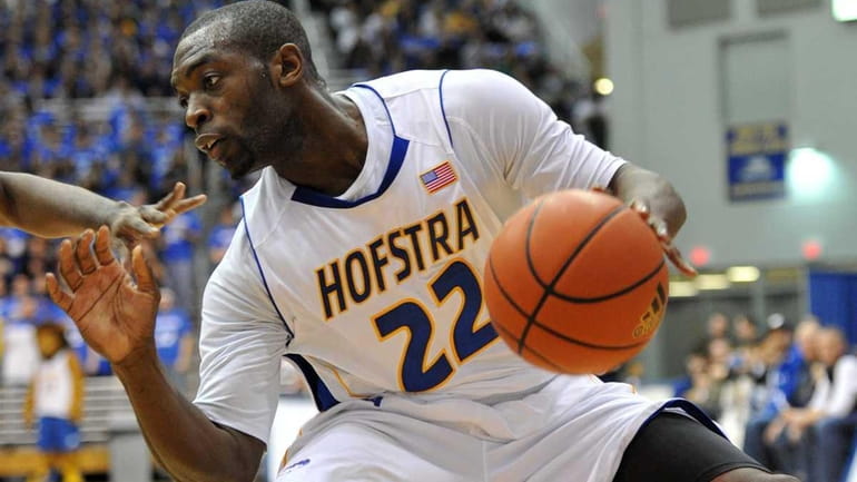 Hofstra point guard Charles Jenkins controls the ball during the...