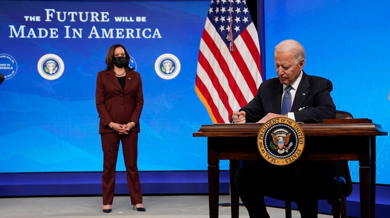 President Joe Biden signs an order closing loopholes in federal...