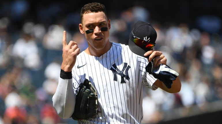 Yankees centerfielder Aaron Judge gestures during an MLB game against...
