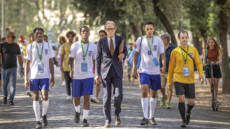 Bill Nighy, middle, in a scene from Netflix's 2024 film...