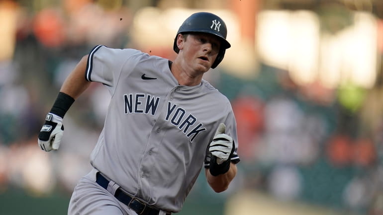 Yankees' DJ LeMahieu runs the bases while scoring from first...