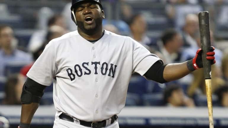 Boston Red Sox designated hitter David Ortiz reacts during his...
