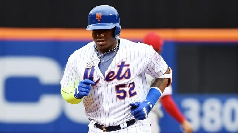 Yoenis Cespedes of the Mets rounding 2nd. base after hitting...
