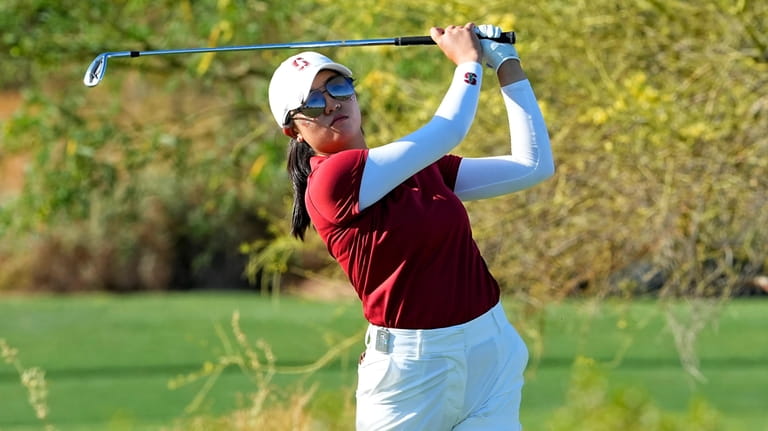 Stanford golfer Rose Zhang hits from the 16th tee during...