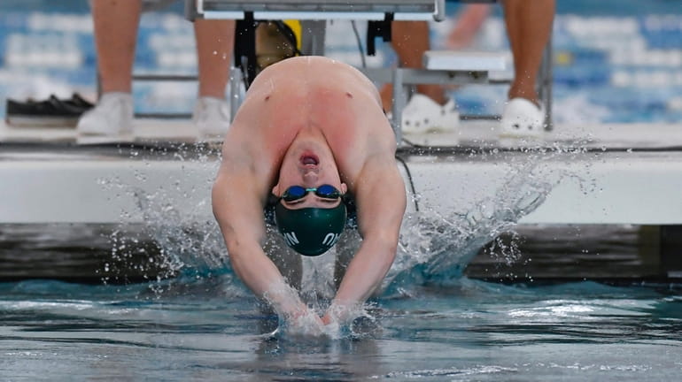 South Side-Lynbrook's Nicholas Rhodes swims in a preliminary heat of...