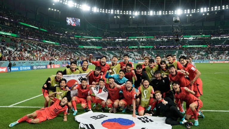 South Korea's players celebrate at the end of the World...