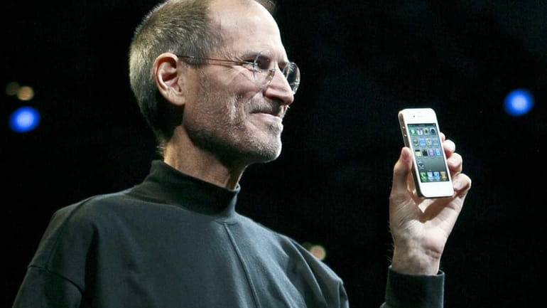 Apple chief executive Steve Jobs introduces the iPhone 4 during...