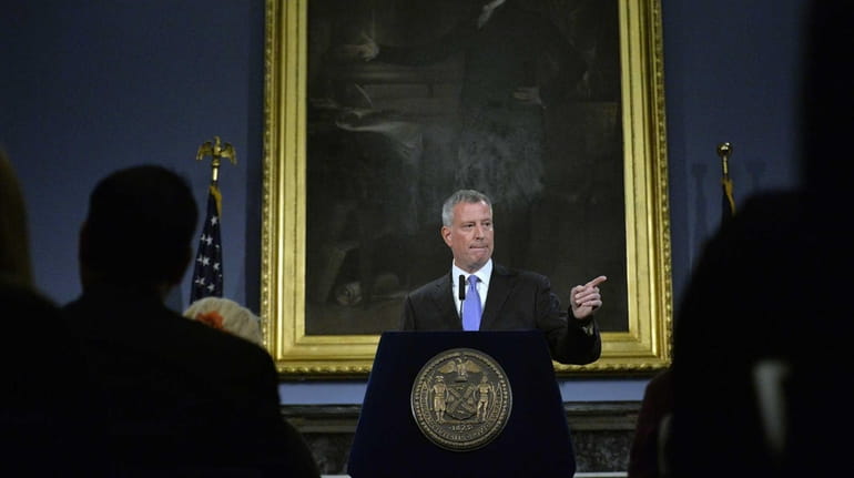 Mayor Bill de Blasio takes questions from the press during...