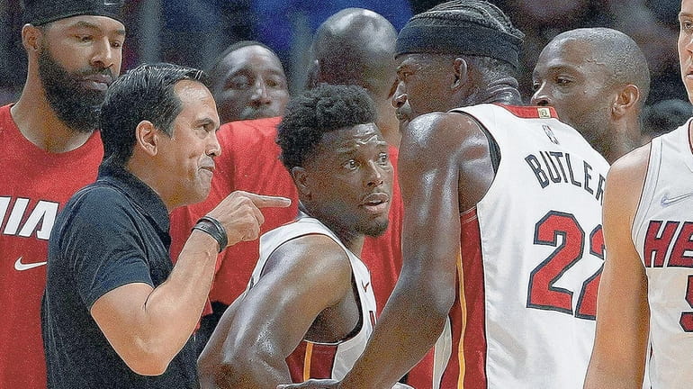 Miami Heat head coach Erik Spoelstra yells at Jimmy Butler...