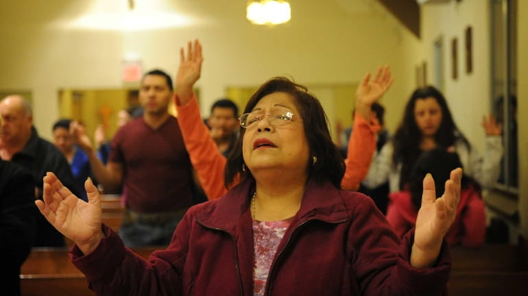 Violeta Torrejon from North Babylons pray during a Latino Charismatic...