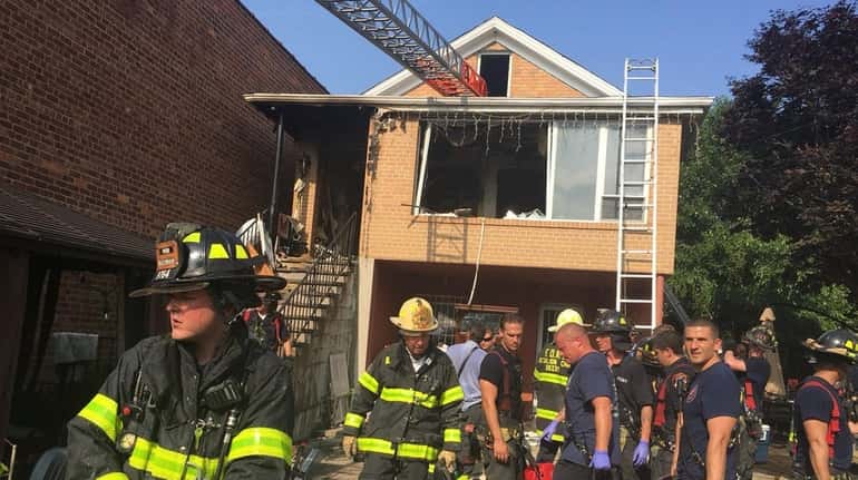 A fire in East Elmhurst, Queens, on Wednesday left three...