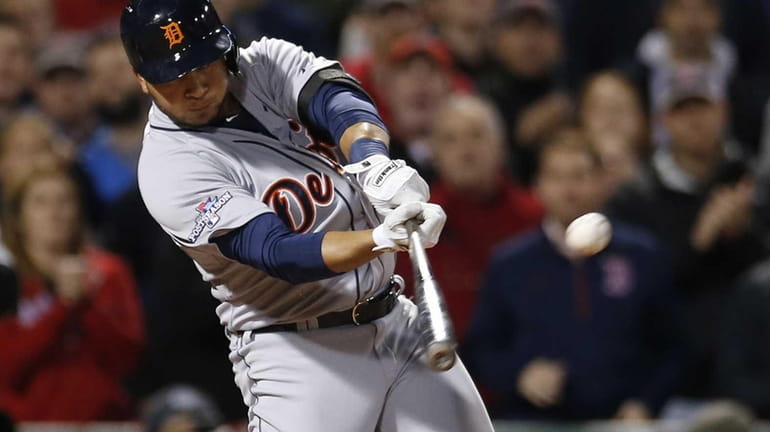 Detroit Tigers hitter Jhonny Peralta hits a single against the...