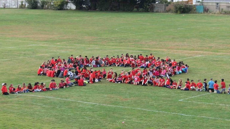 In East Meadow, Meadowbrook Elementary School students recently wore red...