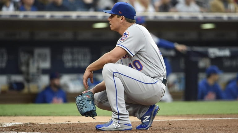 Jason Vargas of the Mets waits by the plate after...