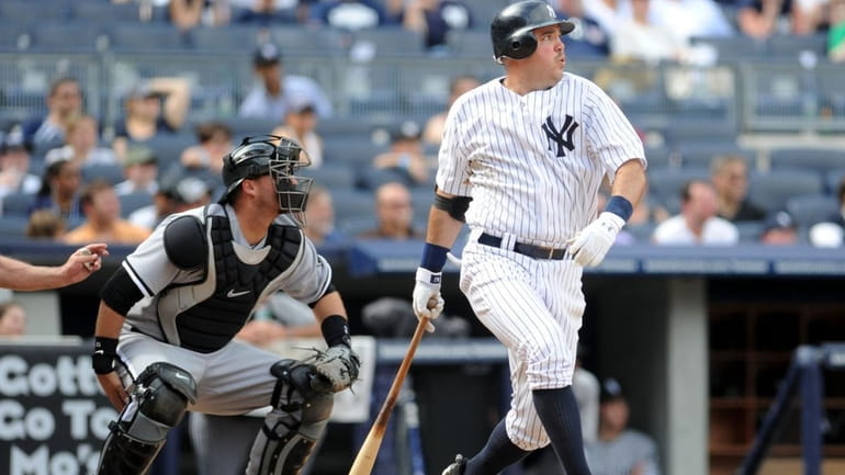 Yankees first baseman Nick Johnson hits a two run double...