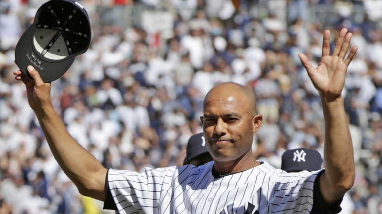 Yankees relief pitcher Mariano Rivera acknowledges the crowd as he...