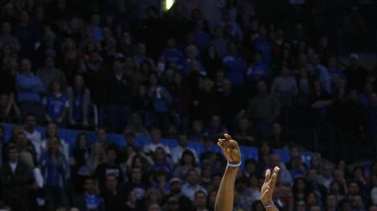 Oklahoma City Thunder forward Kevin Durant (35) shoots a 3-pointer...