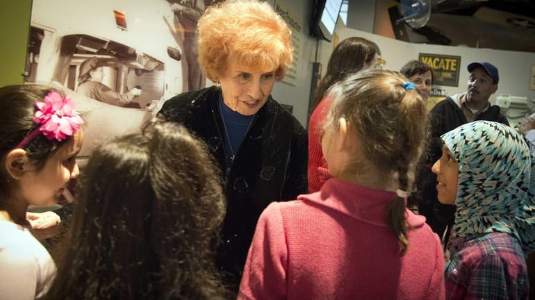 Elinor Otto, also known as Rosie the Riveter, talks with...
