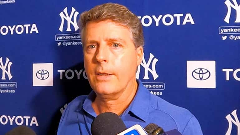 Yankees managing general partner Hal Steinbrenner speaking to reporters in...