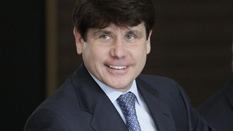 Former Illinois Gov. Rod Blagojevich smiles as he arrives at...