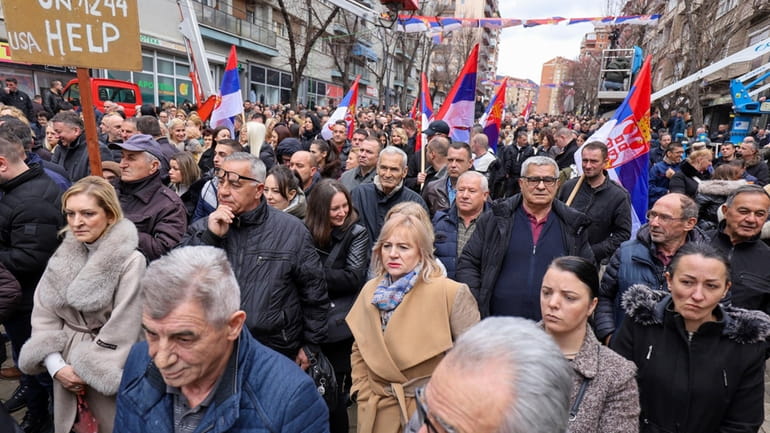 Kosovo Serbs protest against a ban of the use of...