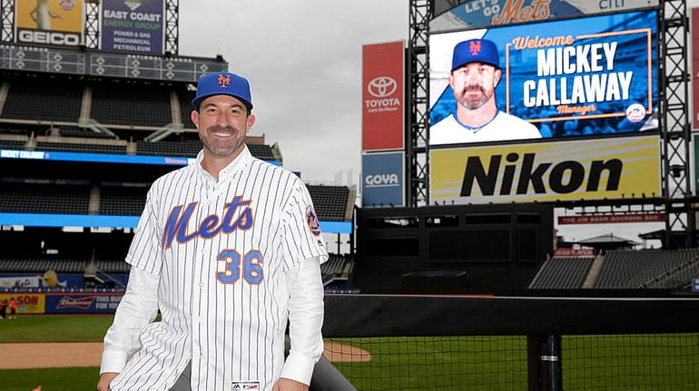 The NY Mets manager MIckey Callaway takes to the field...
