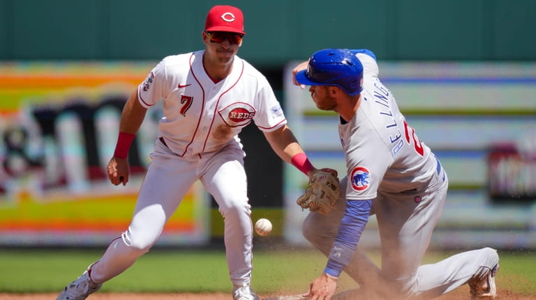 Chicago Cubs' Cody Bellinger, right, steals second base ahead of...