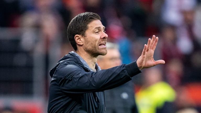 Berlin's JerLeverkusen's head coach Xabi Alonso gestures during the German...