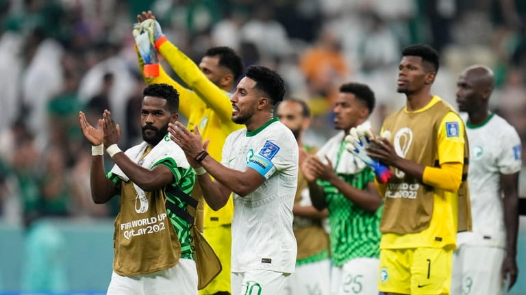 Players of Saudi Arabia clap after the World Cup group...